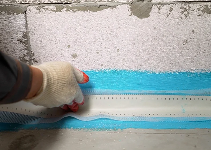 A waterproofed, sealed basement wall